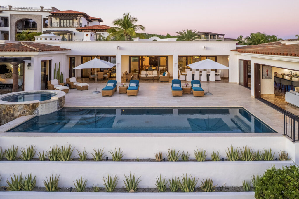 Los Cabos Fundadores Fully remodeled with entertaining in mind, Casa Reino is a stunning Spanish Colonial-style residence located within the double-gated Fundadores community of Puerto Los Cabos. Designed for hosting extended family and friends while maintaining exceptional privacy, this custom-built home blends timeless architecture with modern luxury and efficiency.An expansive pool terrace invites relaxed lounging under the renowned Los Cabos sunshine, complemented by shaded outdoor living and dining areas and multiple interior courtyards that provide privacy for guest suites. A brand-new bar, media, and entertainment room creates the perfect setting for dinner parties and special events.The thoughtful floor plan features a luxurious master suite with soaking tub and indoor/outdoor shower, along with four private guest suites, each positioned for comfort and seclusion. Modern upgrades throughout the home include all-new plumbing, air conditioning, doors, windows, lighting, and furnishings.Designed for efficiency and convenience, Casa Reino is equipped with a solar system, solar pool heater/chiller, and solar heat pump, keeping operating costs low. Additional highlights include an oversized two-car garage with commercial refrigerator and freezer, a new laundry room with dual washer/dryer sets, and a new BBQ cook center with wet bar, icemaker, and refrigeration. The pool has been newly refinished, exterior travertine decking installed, and a complete hurricane shutter system added.Residents of Puerto Los Cabos enjoy 27 holes of Nicklaus and Norman signature golf, with the option to transfer a golf membership at the purchaser's cost. Membership also includes access to tennis and pickleball courts. Fundadores HOA fees include exclusive access to the Fundadores Beach Club, featuring an oceanfront infinity pool, Jacuzzi, fitness center, event lawn, restaurant, and spa services.Ideally located just 5 minutes from the Puerto Los Cabos Marina, 10 minutes from downtown San José del Cabo, and 30 minutes from Los Cabos International Airport, Casa Reino offers effortless access to world-class dining, shopping, and lifestyle amenities.Special Features & UpgradesSolar system in placeSolar pool heater and chillerNewly remodeled pool with new finishesNew exterior travertine deckingNew bar / media / family roomNew laundry room with double washer & dryersNew air conditioning throughoutNew furnishingsNew kitchen appliances: refrigerator, two dishwashers, ice maker, beverage fridge & drawersNew sinks and faucets in kitchenSonos sound systemNew doors and windowsNew hurricane protection systemNew interior and exterior lightingCommercial refrigerator and freezer in garageNew countertops and cabinetry in kitchenette and bath at Guest Casita #4 – 218 Padre Piccolo, San Jose del Cabo, BS