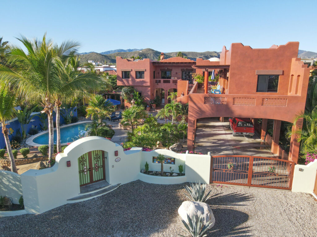 Los Cabos Blue Moon Located in the prestigious gated community of Pedregal, Villa De La Luz offers timeless Mexican Hacienda architecture combined with spacious living and exceptional comfort.This beautifully designed residence features expansive indoor and outdoor areas, ideal for both full-time living and entertaining. Bright interiors flow seamlessly to generous terraces, creating the perfect setting to enjoy Cabo's lifestyle.The home offers 6 en-suite bedrooms, a fully equipped kitchen, and thoughtfully designed living spaces. Outdoor amenities include a private swimming pool, jacuzzi, and BBQ area, providing an ideal environment for relaxation and gatherings.Include a two-car garage, ample storage, and access to Pedregal's exclusive amenities, including 24/7 security, beach and green areas. – 275 Camino del Mar, Cabo San Lucas, BS
