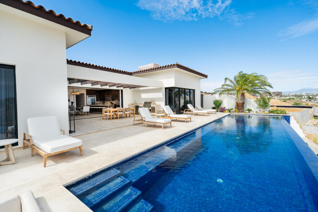 Los Cabos Fundadores Fully remodeled with entertaining in mind, Casa Reino is a stunning Spanish Colonial-style residence located within the double-gated Fundadores community of Puerto Los Cabos. Designed for hosting extended family and friends while maintaining exceptional privacy, this custom-built home blends timeless architecture with modern luxury and efficiency.An expansive pool terrace invites relaxed lounging under the renowned Los Cabos sunshine, complemented by shaded outdoor living and dining areas and multiple interior courtyards that provide privacy for guest suites. A brand-new bar, media, and entertainment room creates the perfect setting for dinner parties and special events.The thoughtful floor plan features a luxurious master suite with soaking tub and indoor/outdoor shower, along with four private guest suites, each positioned for comfort and seclusion. Modern upgrades throughout the home include all-new plumbing, air conditioning, doors, windows, lighting, and furnishings.Designed for efficiency and convenience, Casa Reino is equipped with a solar system, solar pool heater/chiller, and solar heat pump, keeping operating costs low. Additional highlights include an oversized two-car garage with commercial refrigerator and freezer, a new laundry room with dual washer/dryer sets, and a new BBQ cook center with wet bar, icemaker, and refrigeration. The pool has been newly refinished, exterior travertine decking installed, and a complete hurricane shutter system added.Residents of Puerto Los Cabos enjoy 27 holes of Nicklaus and Norman signature golf, with the option to transfer a golf membership at the purchaser's cost. Membership also includes access to tennis and pickleball courts. Fundadores HOA fees include exclusive access to the Fundadores Beach Club, featuring an oceanfront infinity pool, Jacuzzi, fitness center, event lawn, restaurant, and spa services.Ideally located just 5 minutes from the Puerto Los Cabos Marina, 10 minutes from downtown San José del Cabo, and 30 minutes from Los Cabos International Airport, Casa Reino offers effortless access to world-class dining, shopping, and lifestyle amenities.Special Features & UpgradesSolar system in placeSolar pool heater and chillerNewly remodeled pool with new finishesNew exterior travertine deckingNew bar / media / family roomNew laundry room with double washer & dryersNew air conditioning throughoutNew furnishingsNew kitchen appliances: refrigerator, two dishwashers, ice maker, beverage fridge & drawersNew sinks and faucets in kitchenSonos sound systemNew doors and windowsNew hurricane protection systemNew interior and exterior lightingCommercial refrigerator and freezer in garageNew countertops and cabinetry in kitchenette and bath at Guest Casita #4 – At Quivira, Cielo Marbella, Villa 45, Pacific, Pacific, BS