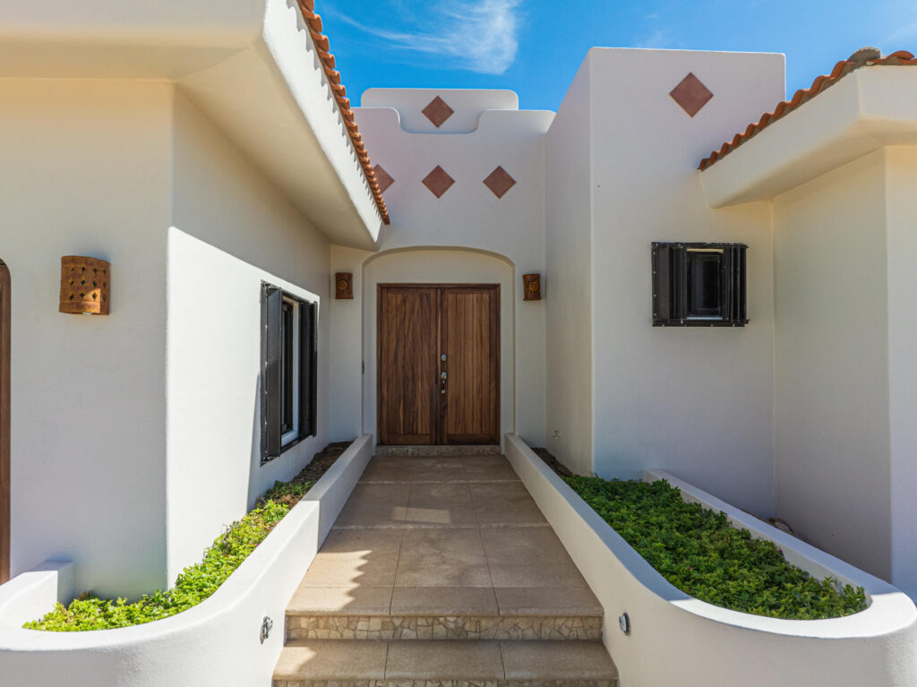 Los Cabos Los Valles Sophisticated and solidly built, this 5,588 sq.ft. estate in Club Campestre offers luxury living with exceptional construction quality rarely found in Los Cabos. Residents enjoy exclusive access to a private beach club and world-class golf course, all just minutes from San Jose vibrant dining and culture. The home features 4 ensuite bedrooms, a 3-stop elevator, and a Generac backup system. Entertain in style with a chef's kitchen, wine room with Tzalam wood cabinetry, and an outdoor BBQ area with fire pit. Relax by the heated pool or on the Jacuzzi terrace with partial ocean – Ave. Marlin, Pacific, BS