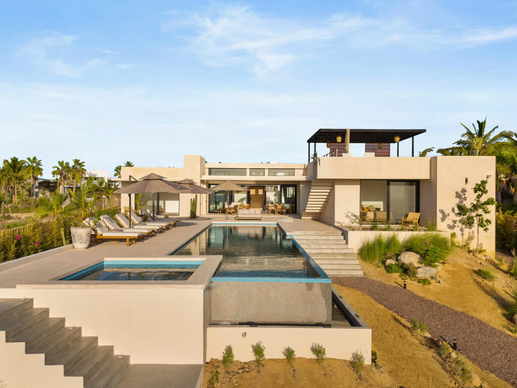 Los Cabos Los Valles Sophisticated and solidly built, this 5,588 sq.ft. estate in Club Campestre offers luxury living with exceptional construction quality rarely found in Los Cabos. Residents enjoy exclusive access to a private beach club and world-class golf course, all just minutes from San Jose vibrant dining and culture. The home features 4 ensuite bedrooms, a 3-stop elevator, and a Generac backup system. Entertain in style with a chef's kitchen, wine room with Tzalam wood cabinetry, and an outdoor BBQ area with fire pit. Relax by the heated pool or on the Jacuzzi terrace with partial ocean – Calle Colibri, Pacific, BS