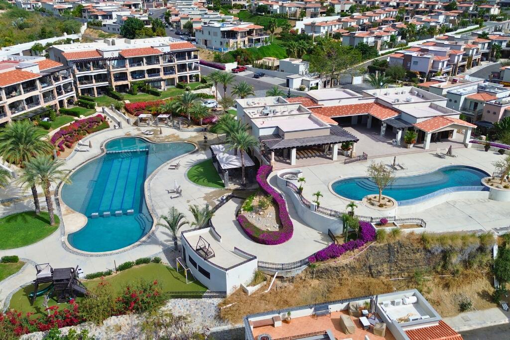 Los Cabos Fundadores Fully remodeled with entertaining in mind, Casa Reino is a stunning Spanish Colonial-style residence located within the double-gated Fundadores community of Puerto Los Cabos. Designed for hosting extended family and friends while maintaining exceptional privacy, this custom-built home blends timeless architecture with modern luxury and efficiency.An expansive pool terrace invites relaxed lounging under the renowned Los Cabos sunshine, complemented by shaded outdoor living and dining areas and multiple interior courtyards that provide privacy for guest suites. A brand-new bar, media, and entertainment room creates the perfect setting for dinner parties and special events.The thoughtful floor plan features a luxurious master suite with soaking tub and indoor/outdoor shower, along with four private guest suites, each positioned for comfort and seclusion. Modern upgrades throughout the home include all-new plumbing, air conditioning, doors, windows, lighting, and furnishings.Designed for efficiency and convenience, Casa Reino is equipped with a solar system, solar pool heater/chiller, and solar heat pump, keeping operating costs low. Additional highlights include an oversized two-car garage with commercial refrigerator and freezer, a new laundry room with dual washer/dryer sets, and a new BBQ cook center with wet bar, icemaker, and refrigeration. The pool has been newly refinished, exterior travertine decking installed, and a complete hurricane shutter system added.Residents of Puerto Los Cabos enjoy 27 holes of Nicklaus and Norman signature golf, with the option to transfer a golf membership at the purchaser's cost. Membership also includes access to tennis and pickleball courts. Fundadores HOA fees include exclusive access to the Fundadores Beach Club, featuring an oceanfront infinity pool, Jacuzzi, fitness center, event lawn, restaurant, and spa services.Ideally located just 5 minutes from the Puerto Los Cabos Marina, 10 minutes from downtown San José del Cabo, and 30 minutes from Los Cabos International Airport, Casa Reino offers effortless access to world-class dining, shopping, and lifestyle amenities.Special Features & UpgradesSolar system in placeSolar pool heater and chillerNewly remodeled pool with new finishesNew exterior travertine deckingNew bar / media / family roomNew laundry room with double washer & dryersNew air conditioning throughoutNew furnishingsNew kitchen appliances: refrigerator, two dishwashers, ice maker, beverage fridge & drawersNew sinks and faucets in kitchenSonos sound systemNew doors and windowsNew hurricane protection systemNew interior and exterior lightingCommercial refrigerator and freezer in garageNew countertops and cabinetry in kitchenette and bath at Guest Casita #4 – Casa 6, Cabo Corridor, BS