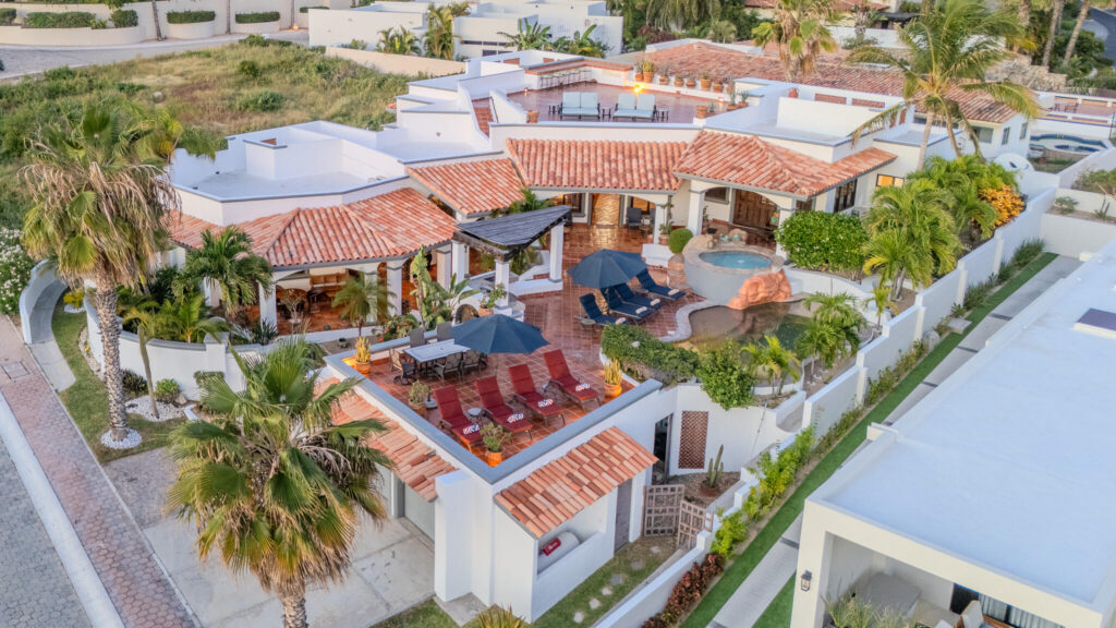 Los Cabos Los Valles Sophisticated and solidly built, this 5,588 sq.ft. estate in Club Campestre offers luxury living with exceptional construction quality rarely found in Los Cabos. Residents enjoy exclusive access to a private beach club and world-class golf course, all just minutes from San Jose vibrant dining and culture. The home features 4 ensuite bedrooms, a 3-stop elevator, and a Generac backup system. Entertain in style with a chef's kitchen, wine room with Tzalam wood cabinetry, and an outdoor BBQ area with fire pit. Relax by the heated pool or on the Jacuzzi terrace with partial ocean – 25 Camino Grande Pedregal, Cabo San Lucas, BS